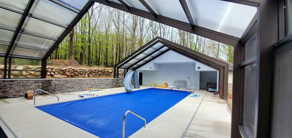 DynaDome | An indoor swimming pool with a retractable enclosure.