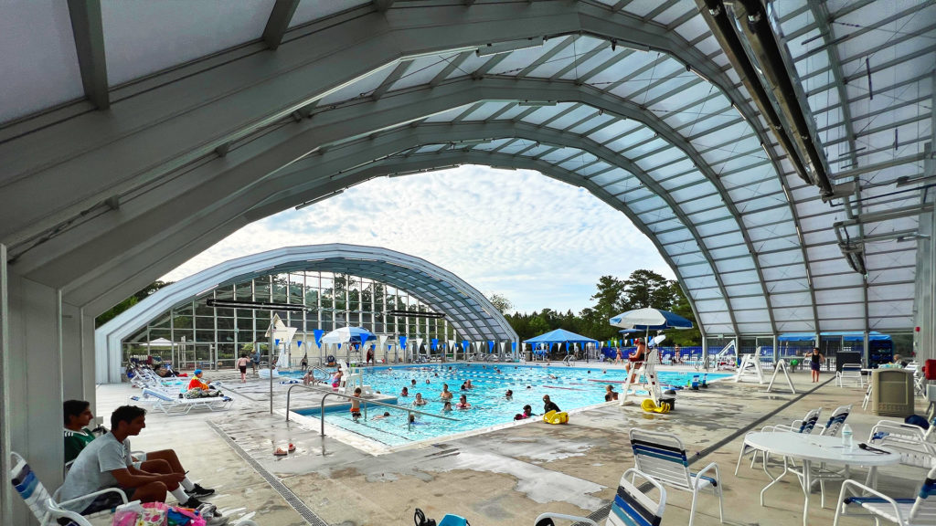 DynaDome | A swimming pool with a retractable enclosure.