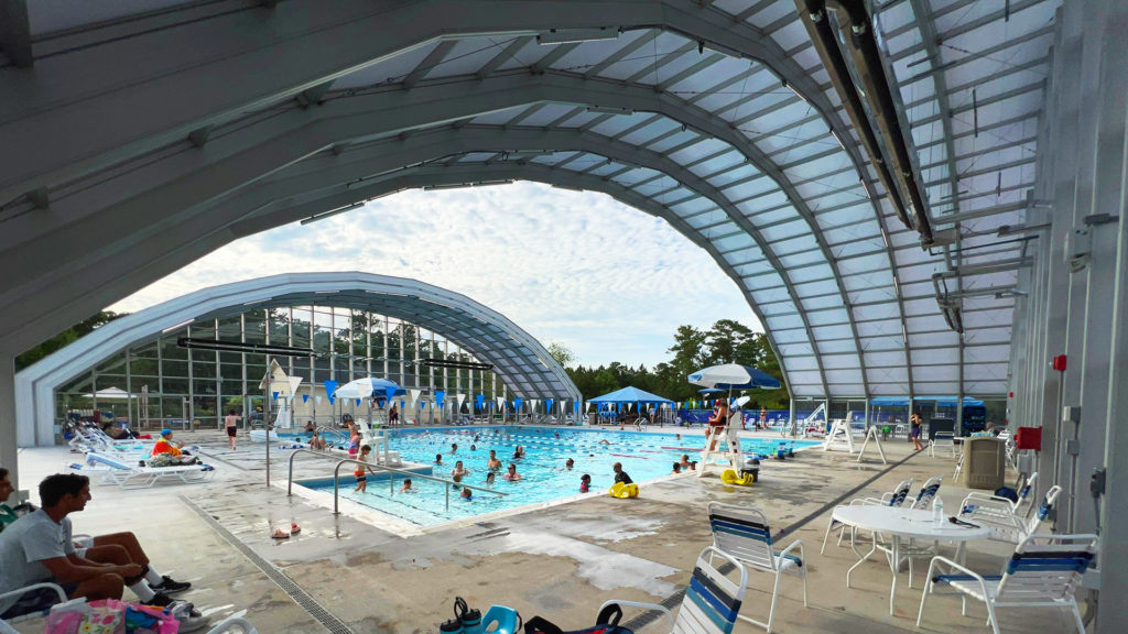 DynaDome | A swimming pool with a retractable enclosure.