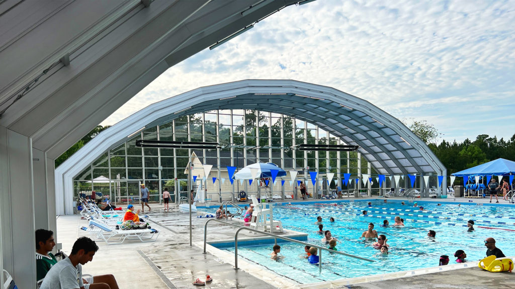 DynaDome | A swimming pool with a retractable enclosure.